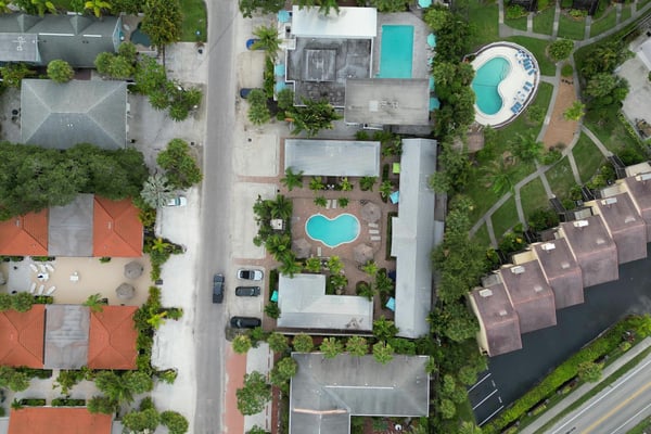 Aerial view of Florida homes with pools in a residential neighbourhood